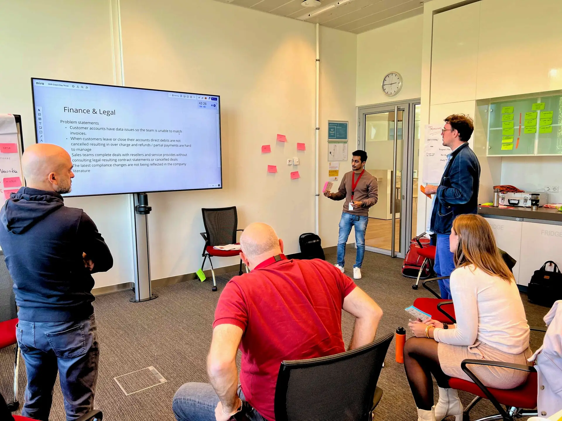 Small group of colleagues discussing OKRs during a breakout session as part of OKR Team Training