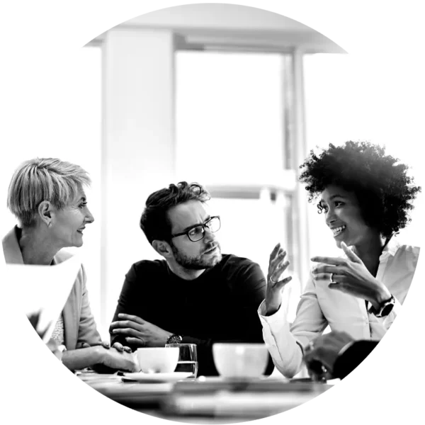 Professionals engaged in a team discussion during an OKR consulting session